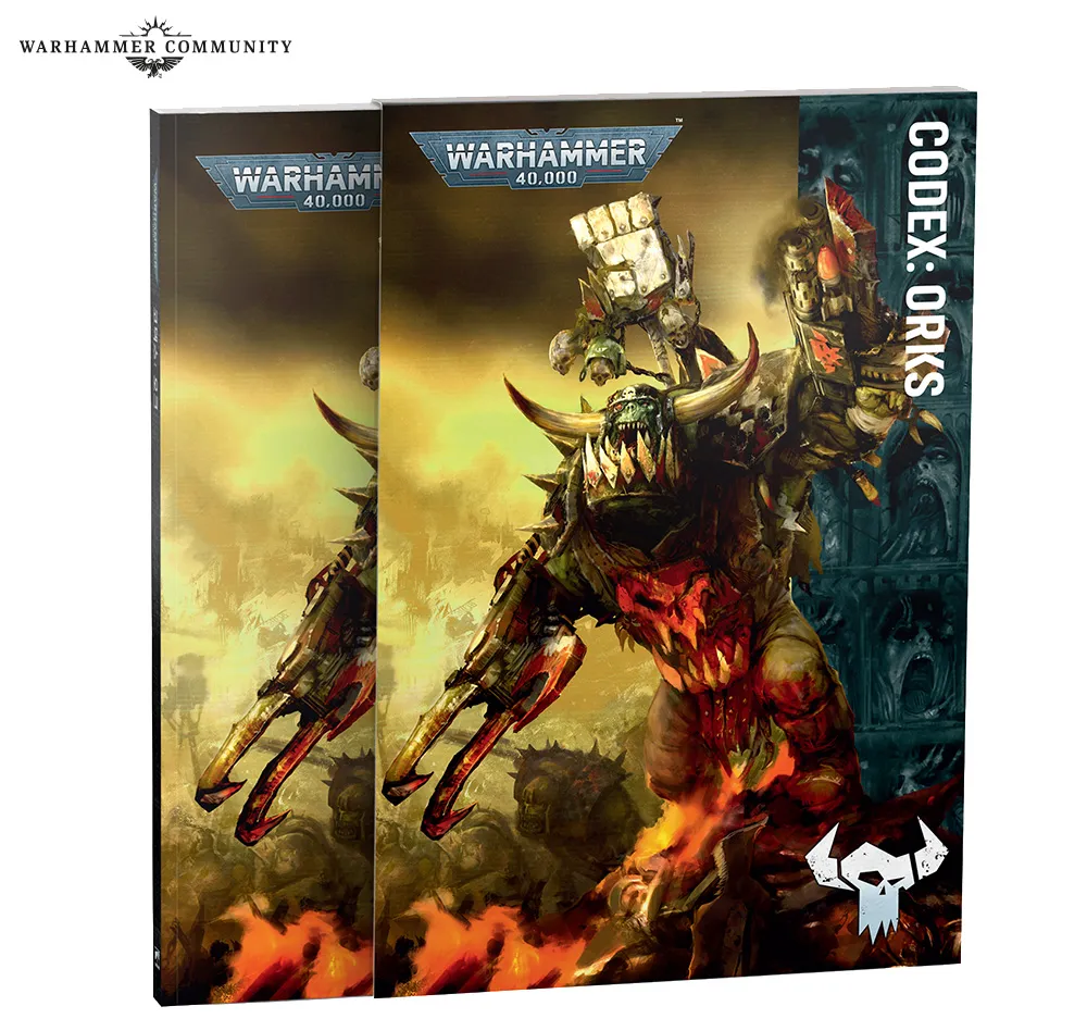 Slipcase and softcover of the new Codex: Orks on a gaming table